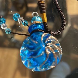 Murano glass cremation necklace with adjustable pulls.